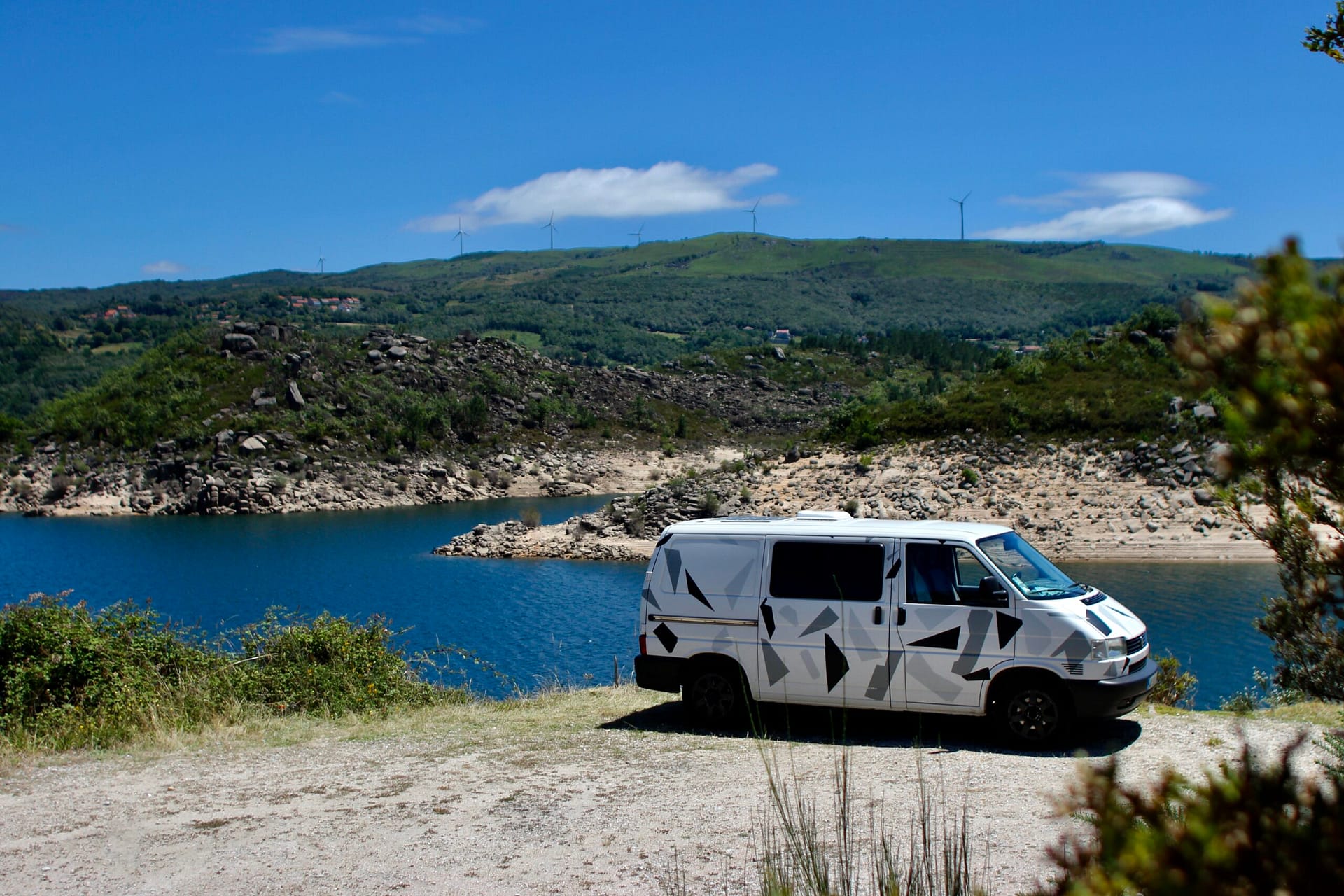 VW Transporter T4 with a lake on the background